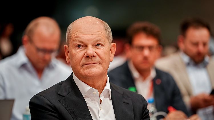 Einen Seitenhieb auf Merz kann Scholz sich nicht verkneifen